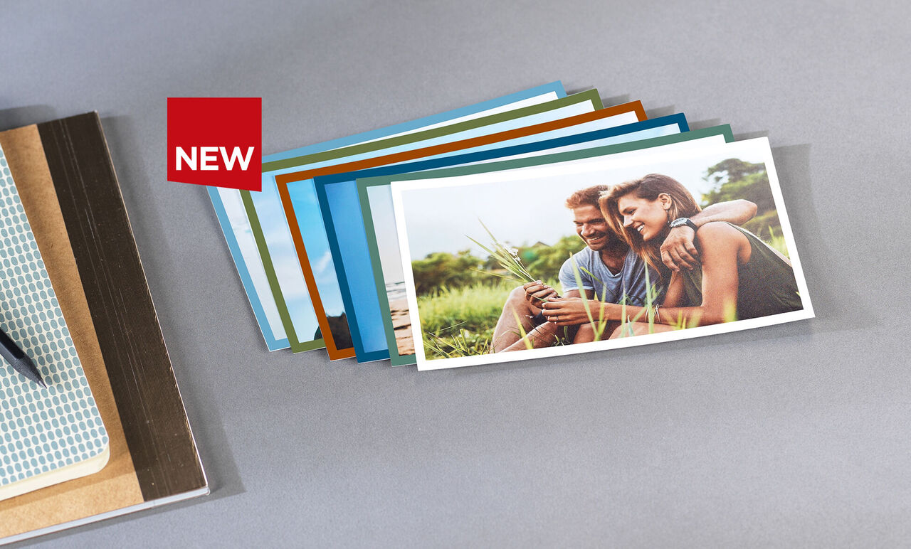 Colorful greeting cards in various colors lie on a table.