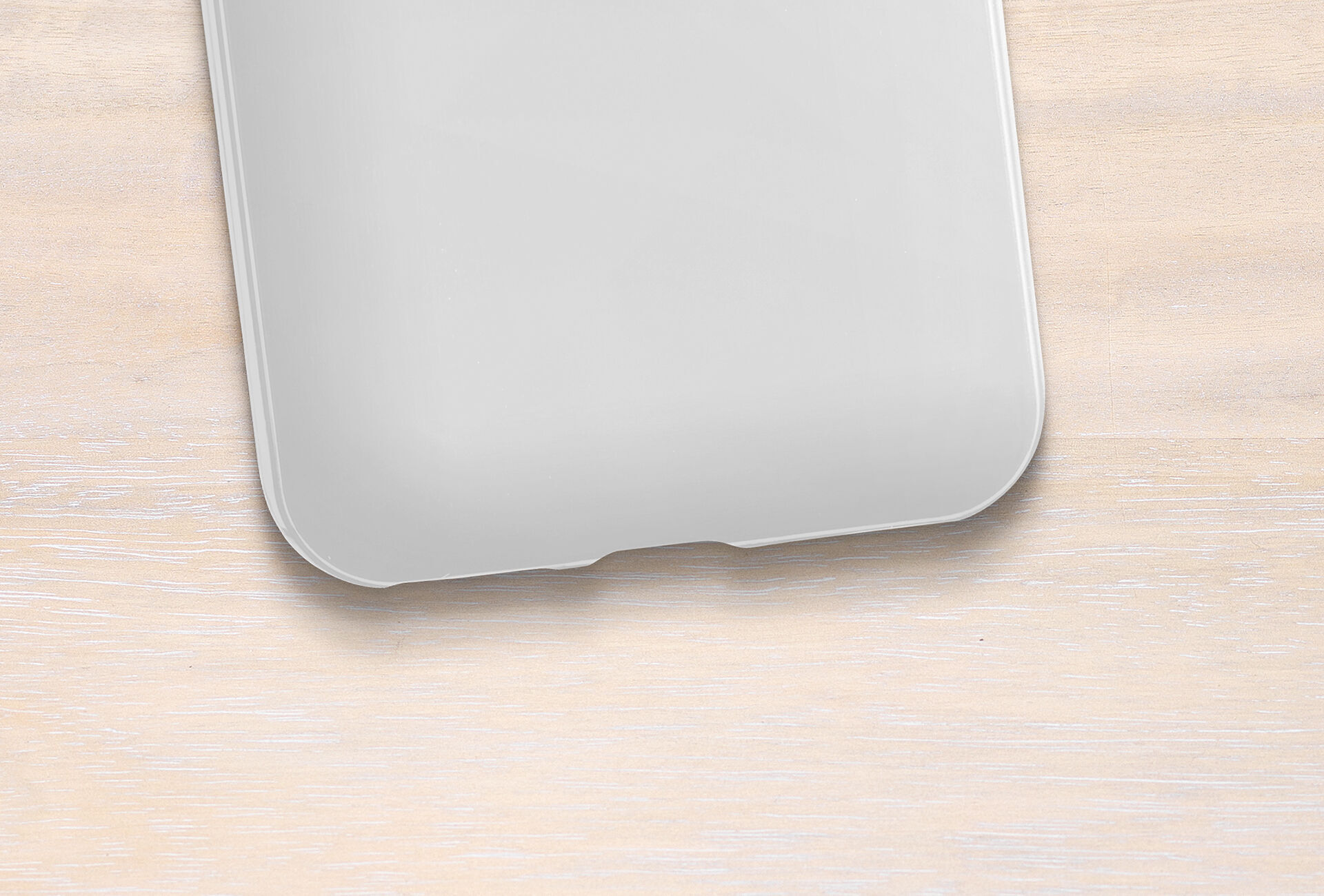 Empty smartphone case on light wooden background.