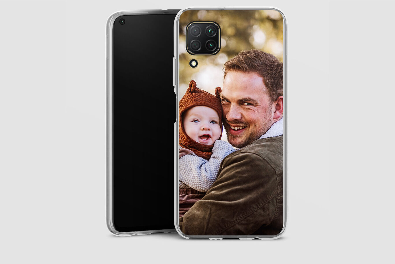 A man holding a child in a warm setting. They radiate joy and affection.