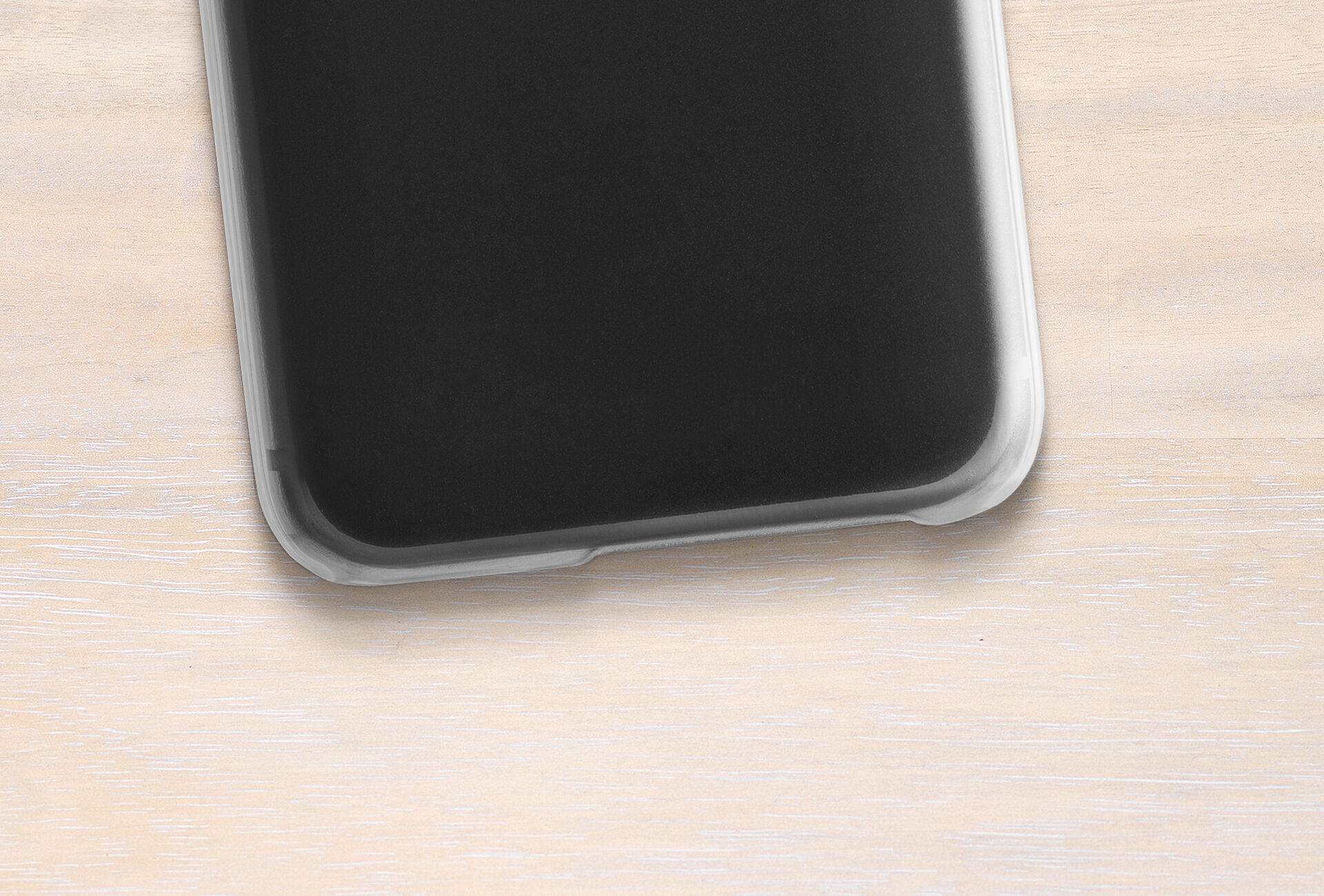 Black smartphone on light wooden surface