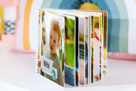 An open CEWE photo book with inspiring memories.