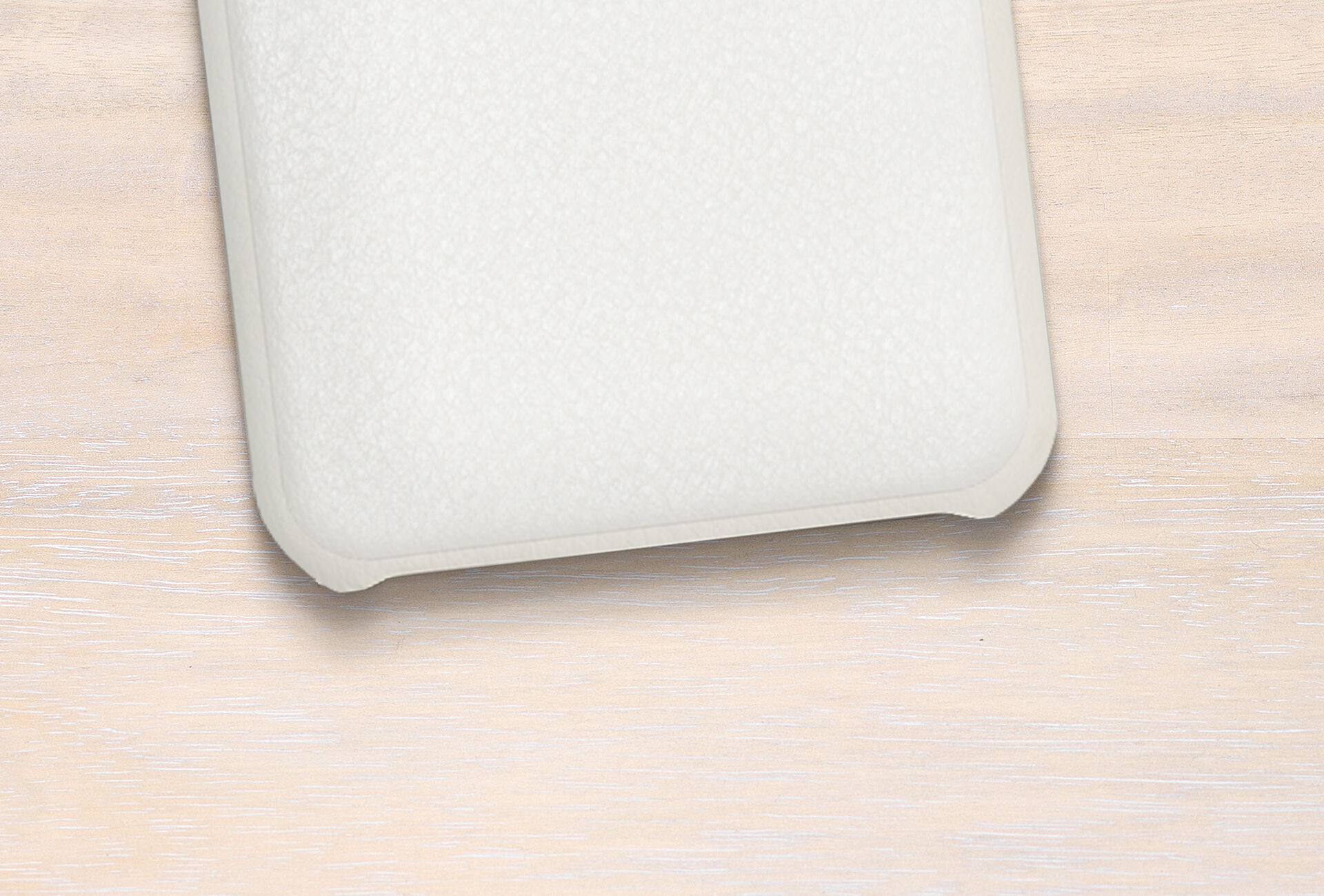 Empty white photo book cover on light background