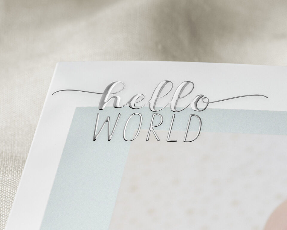 A greeting card with 'hello WORLD' in elegant font.