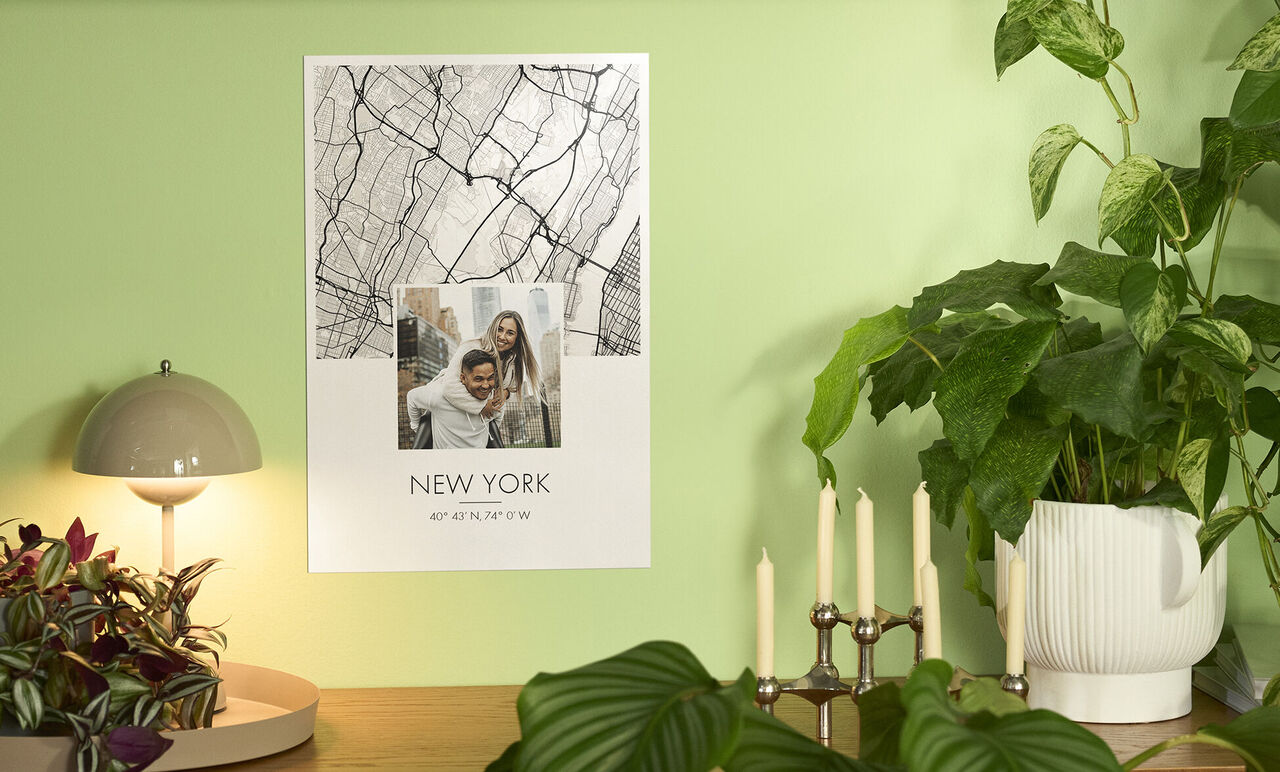 A poster of New York hangs on a green wall. It shows a scene and the text "NEW YORK."