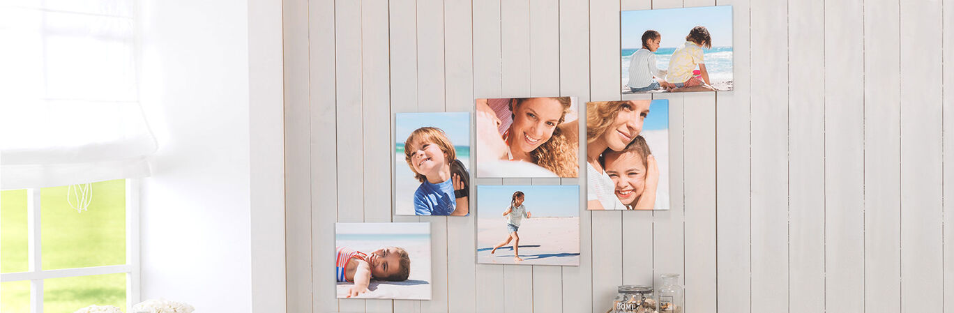 Five photos of happy moments, beautifully arranged on a wall