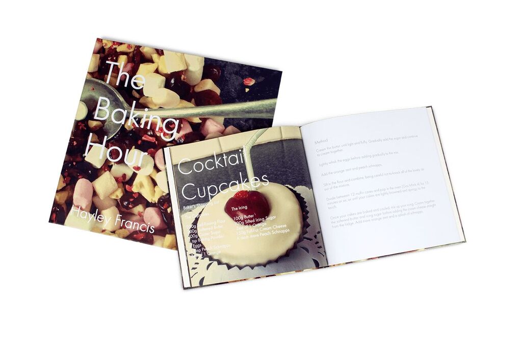 An open recipe book with a page about cocktail cupcakes.
