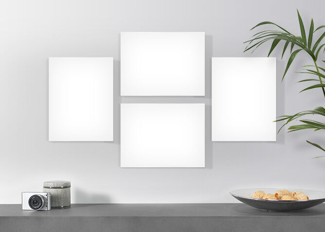 Empty frames on a wall above a modern table.