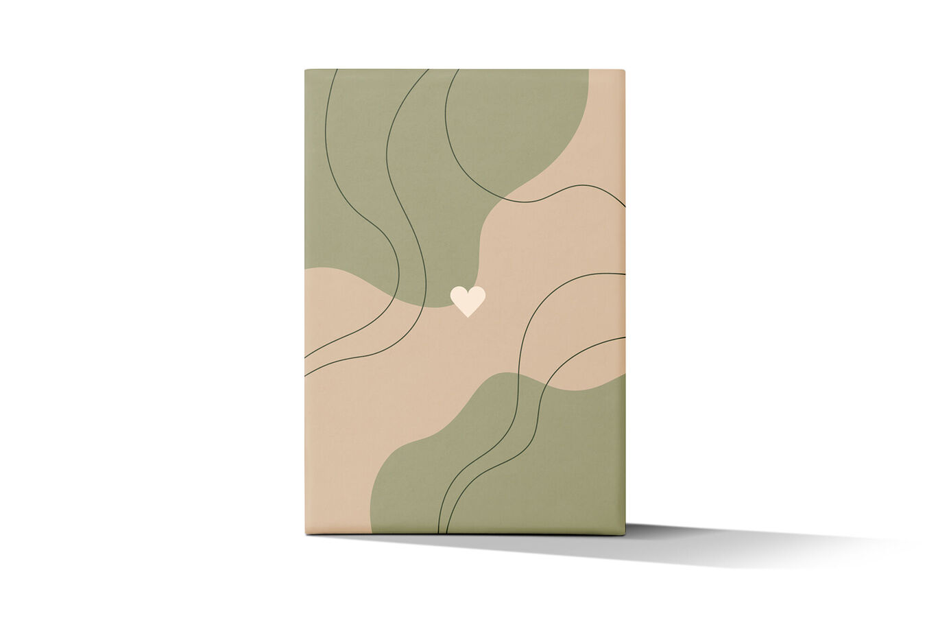 A CEWE photo book with a modern abstract design in soft colors.