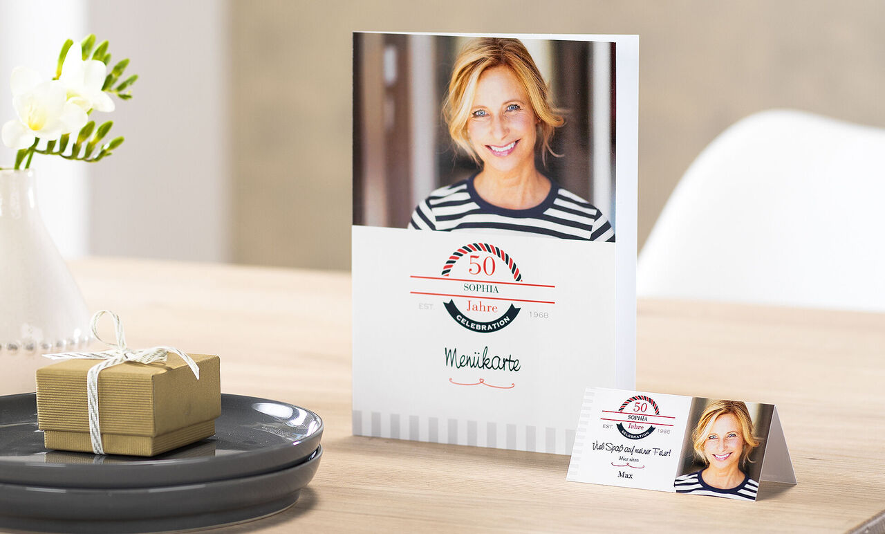 A lovingly designed greeting card set for a special occasion, with an elegant gift box and a plate serving as decoration