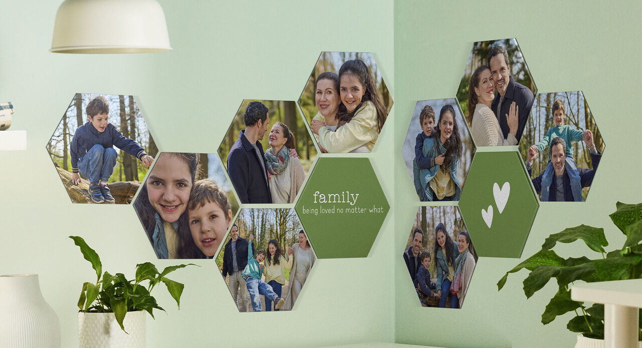 Wall picture with photos of a loving family in nature, surrounded by green accents.