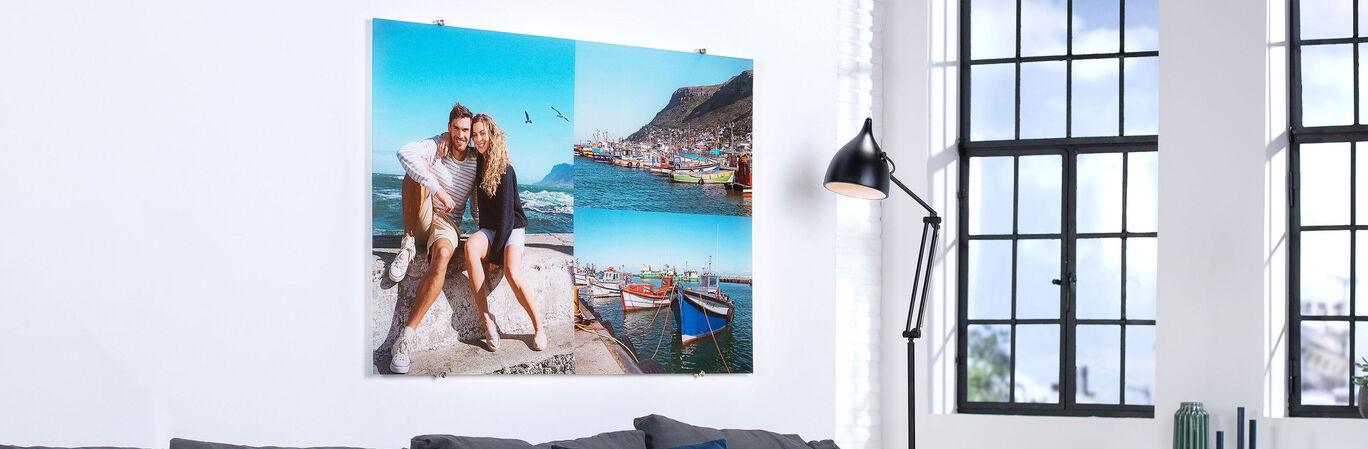 A wall picture with two photos: A couple at the sea and a harbor view.