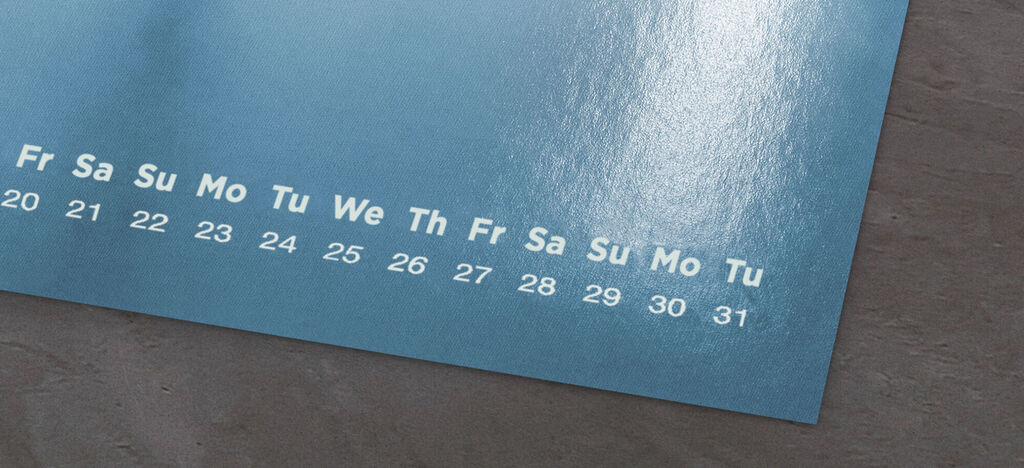 A beautiful photo calendar with blue pages and dated days.